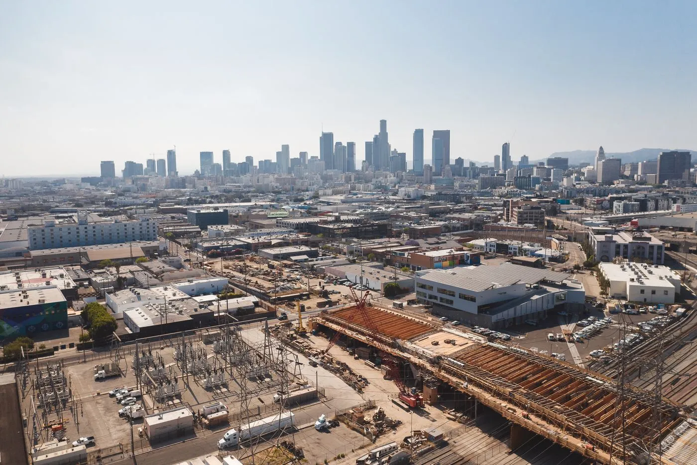 Aerial view of downtown Los Angeles with an active construction site in the foreground