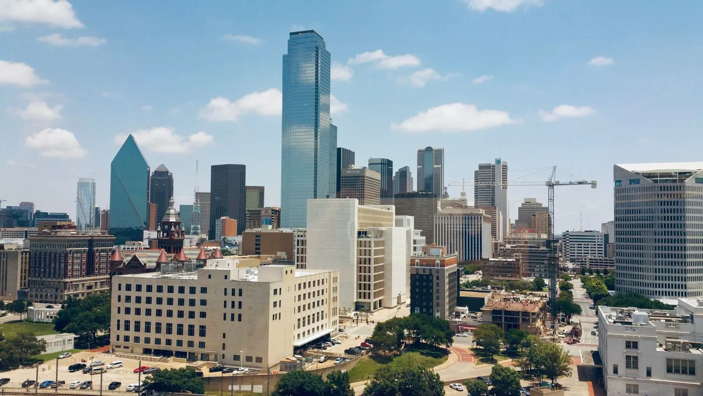Downtown Dallas skyline with a tower crane on the edge of the business district