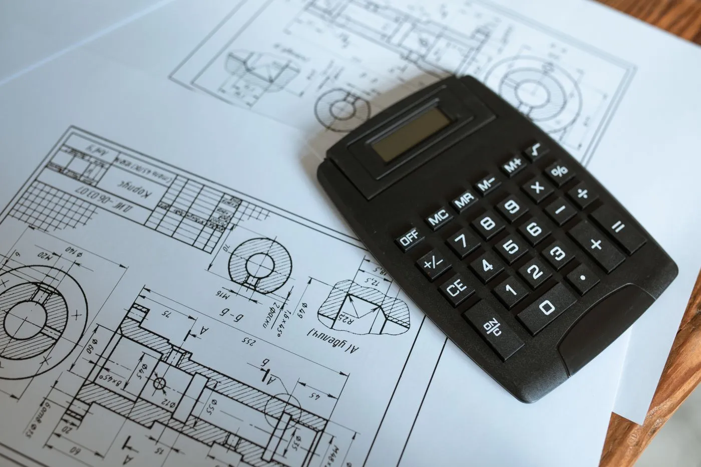 Calculator resting on engineering drawings