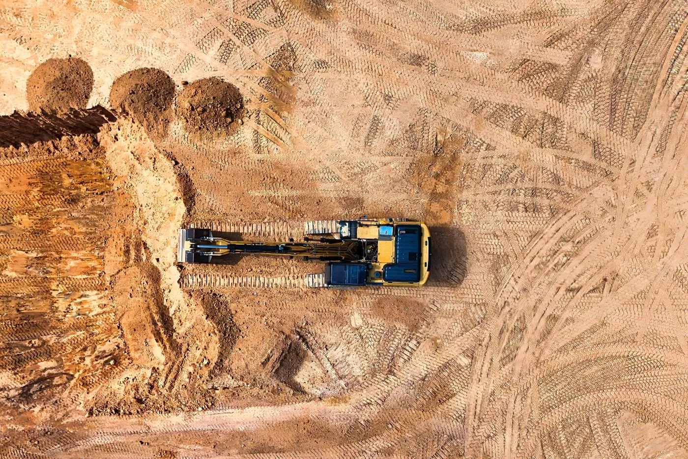 Aerial view of an excavator working on a construction site