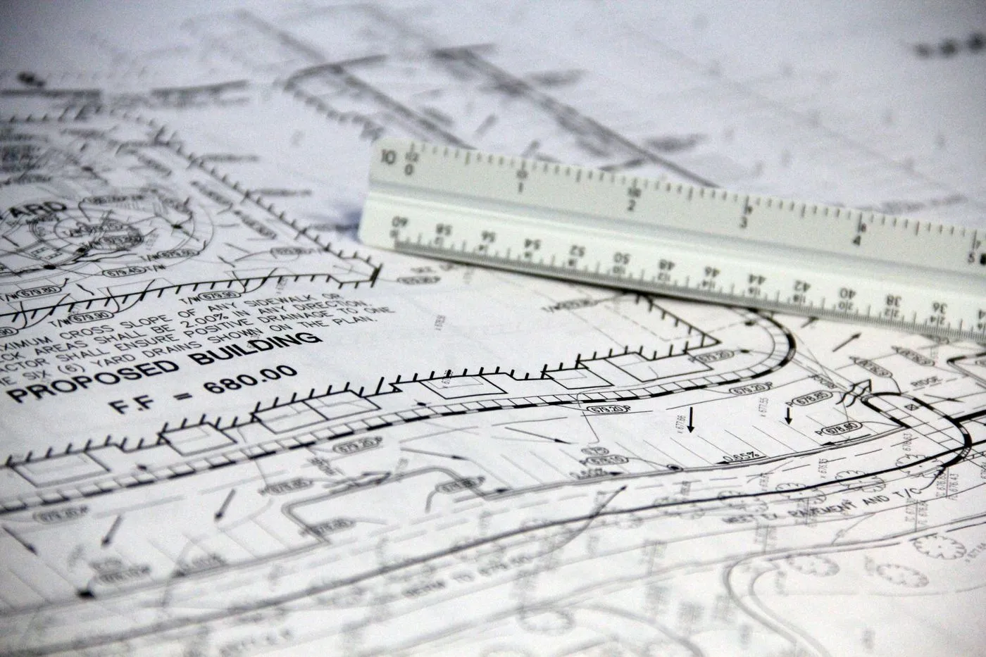 Plan sheet with a scale ruler laid across it