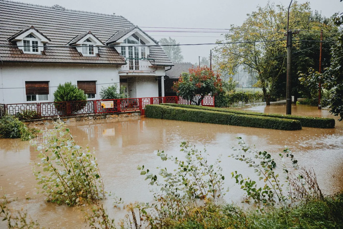House surrounded by floodwater after heavy rain
