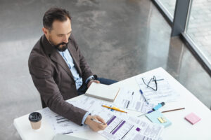 Construction Estimating Services | Cost Estimating | Prime Estimation 43 top view professional employer dressed formally